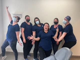 Group photo in scrubs being silly