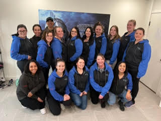 group photo in company vests