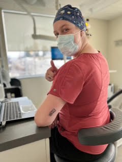 Dental staff giving thumbs up